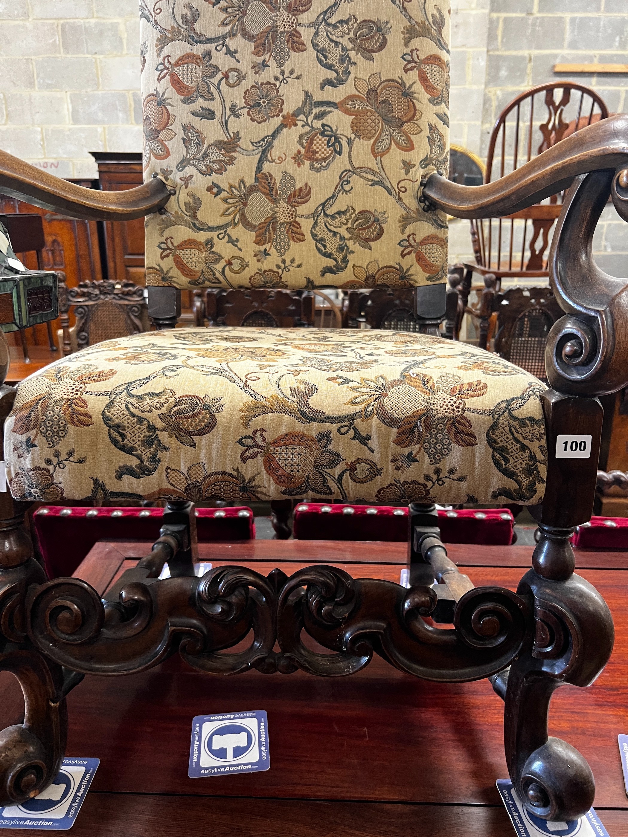 A reproduction Jacobean style mahogany upholstered elbow chair, width 64cm, depth 51cm, height 170cm